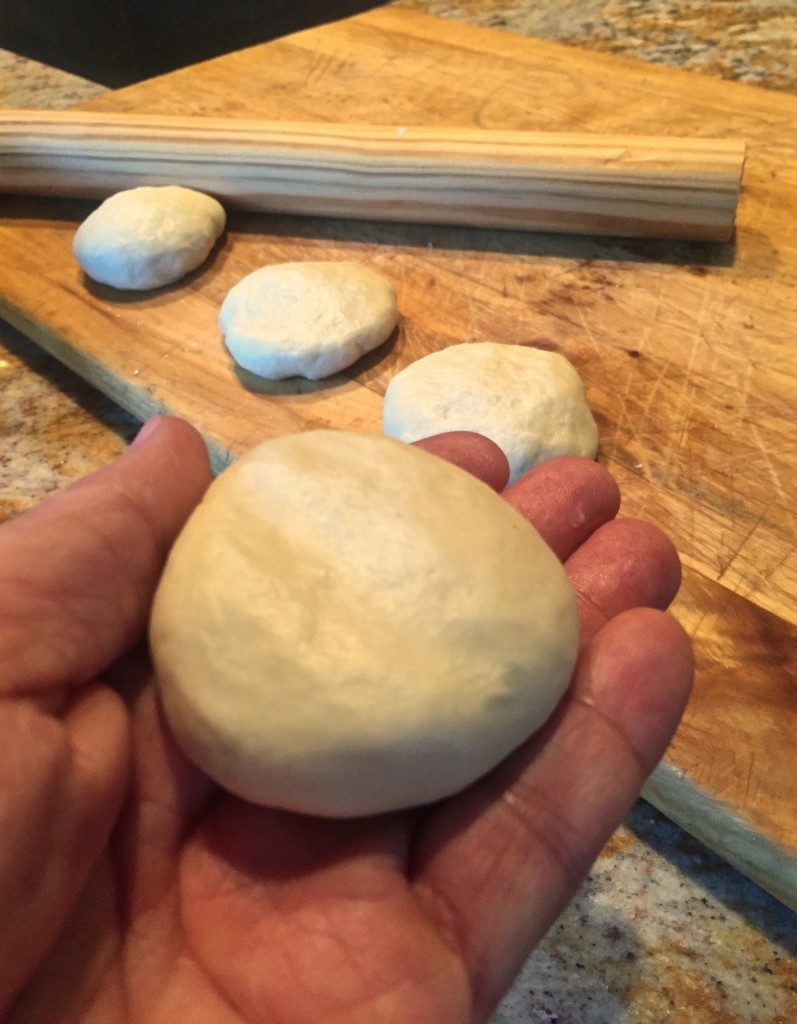 Flour tortillas before rolling, formed into a "testal" 