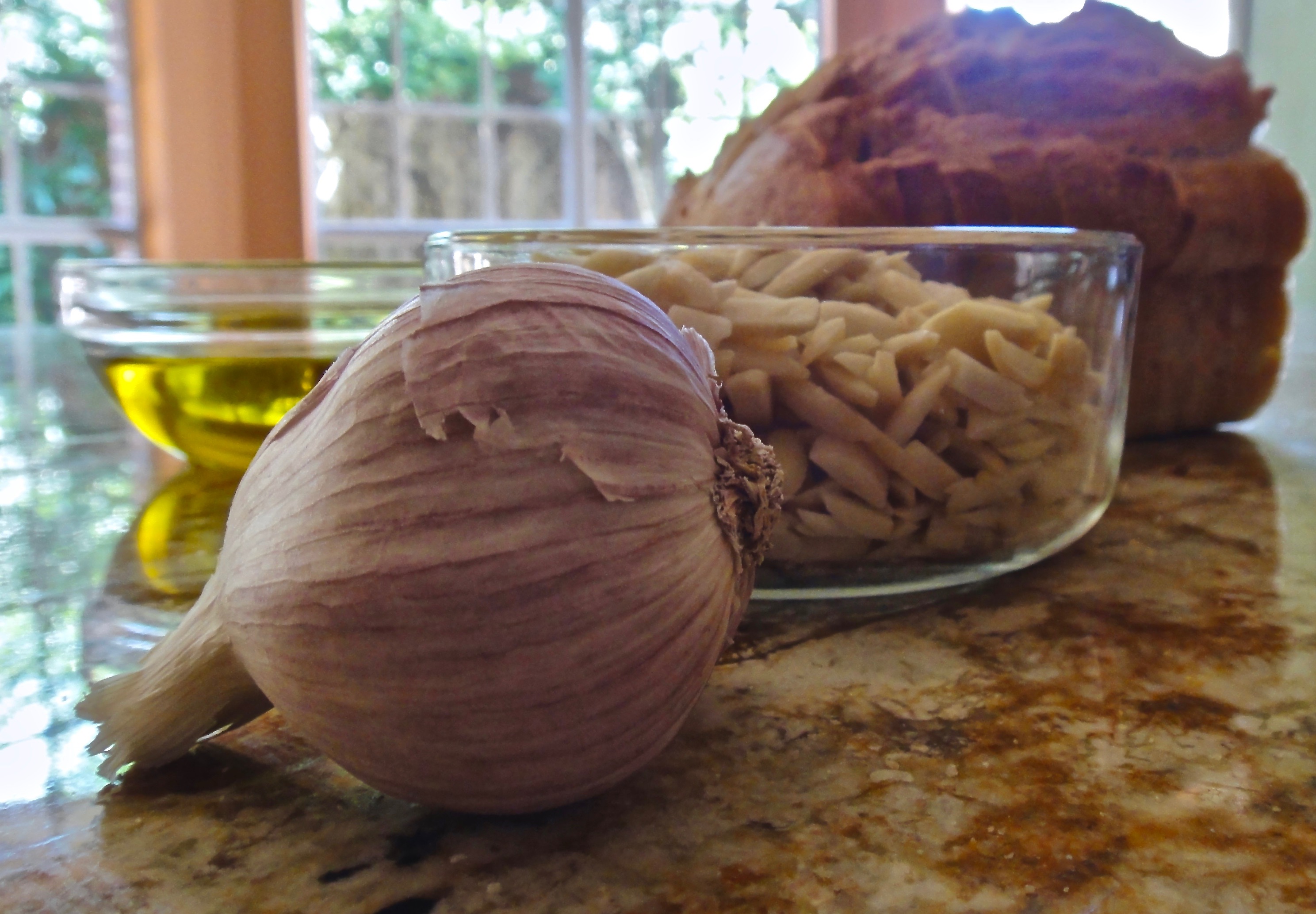 Ajoblanco cold soup ingredients: garlic, almonds, olive oil and bread