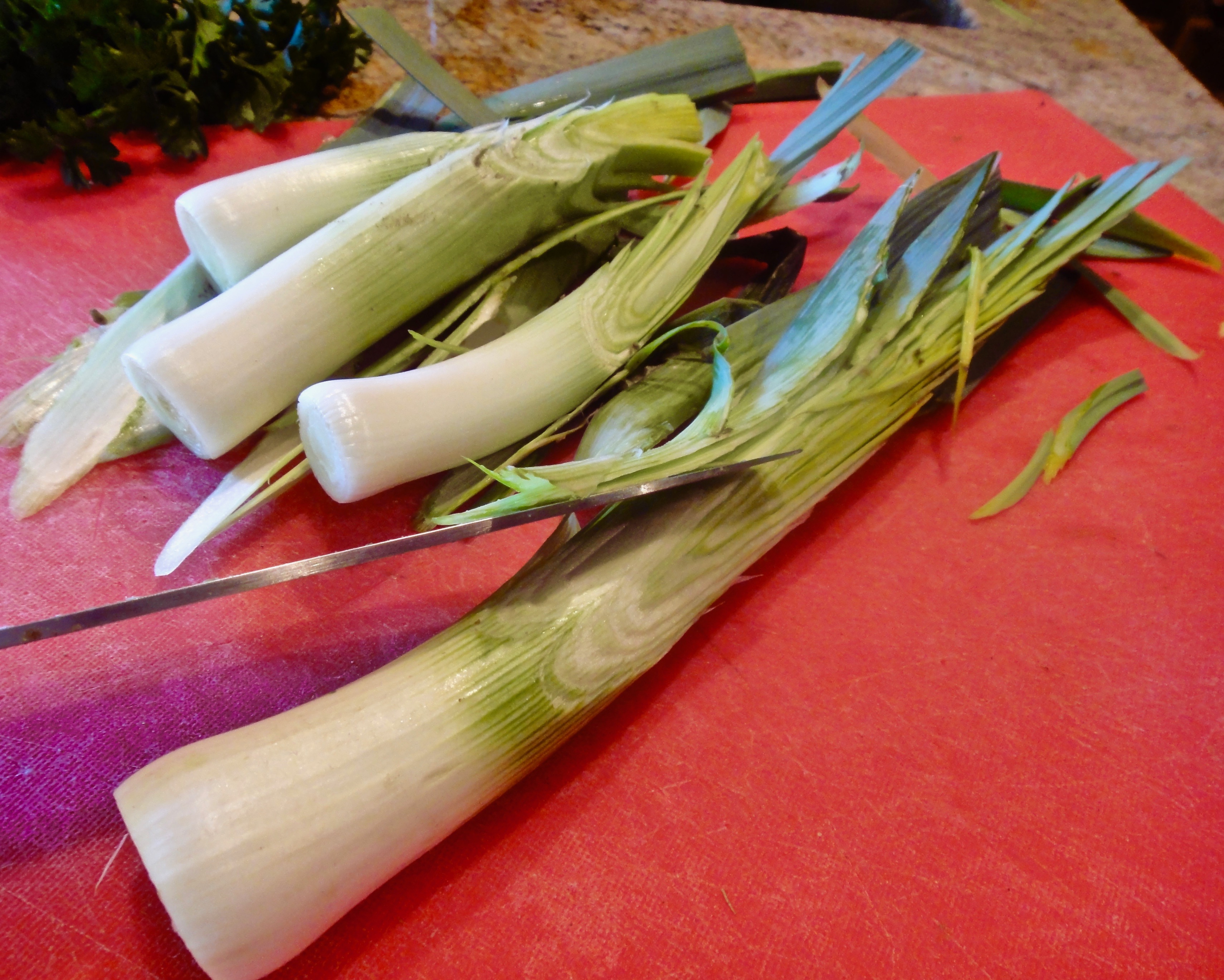 Trim leek, slicing with a sharp bias